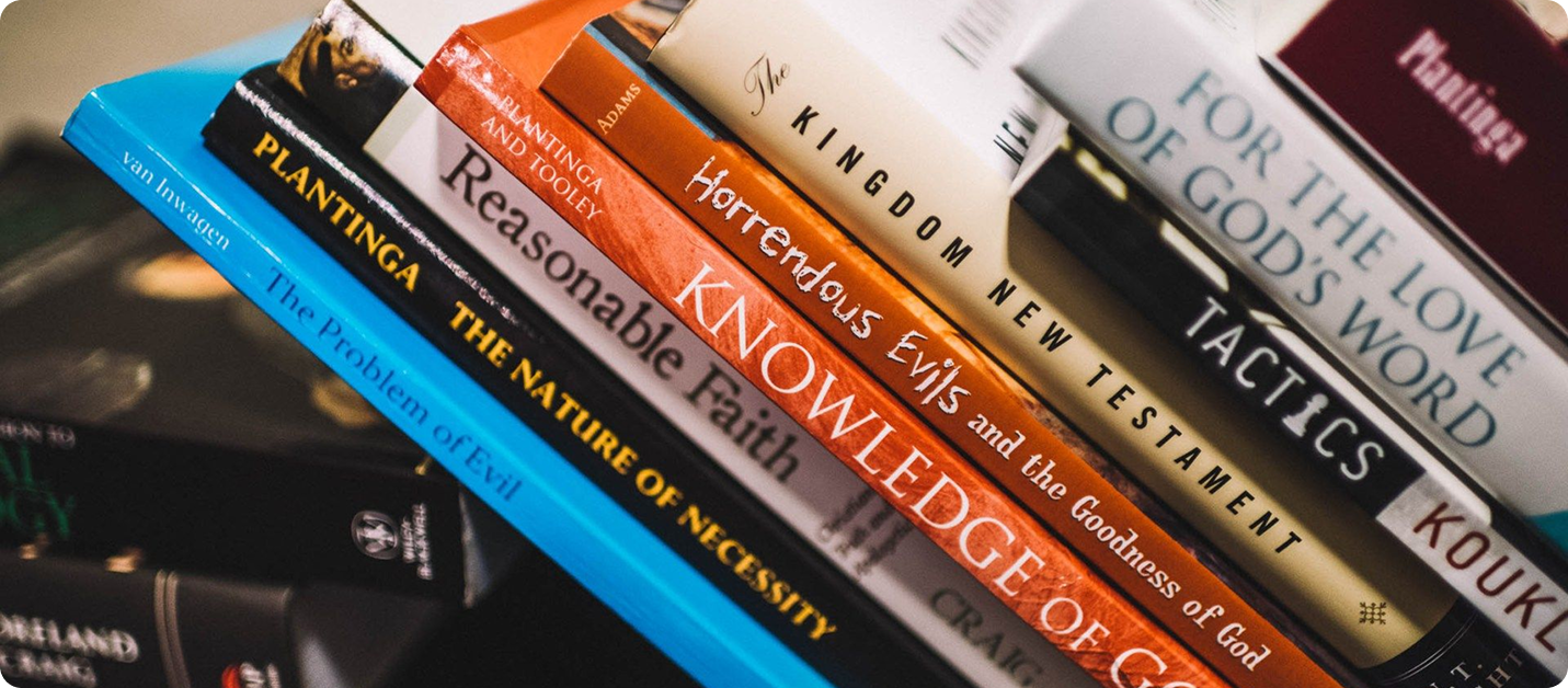 Stack of Christian philosophy books including Plantinga and Craig titles